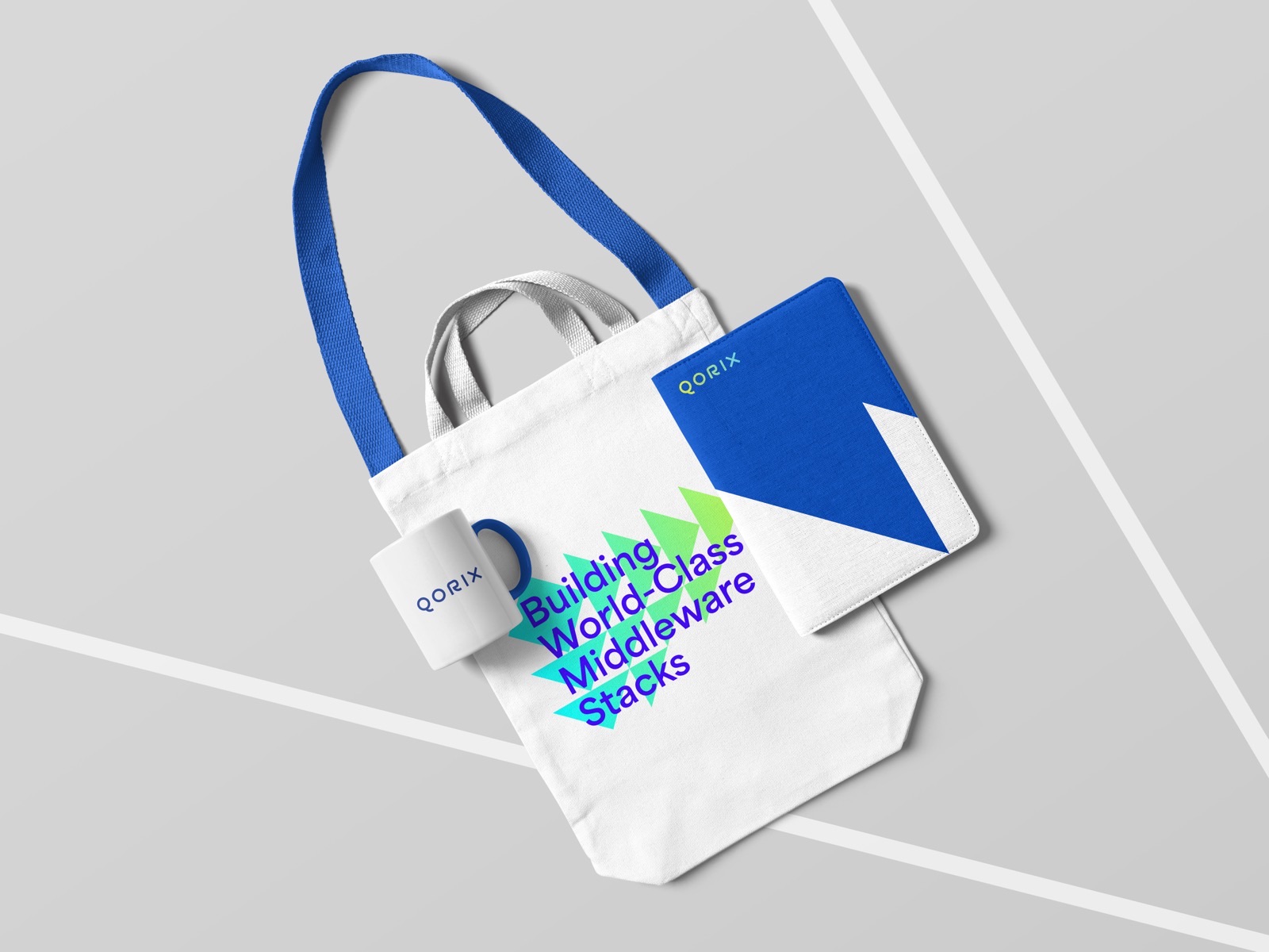 Stofftasche und Notizbuch mit Bildmarke — Qorix, laufende Designbetreuung