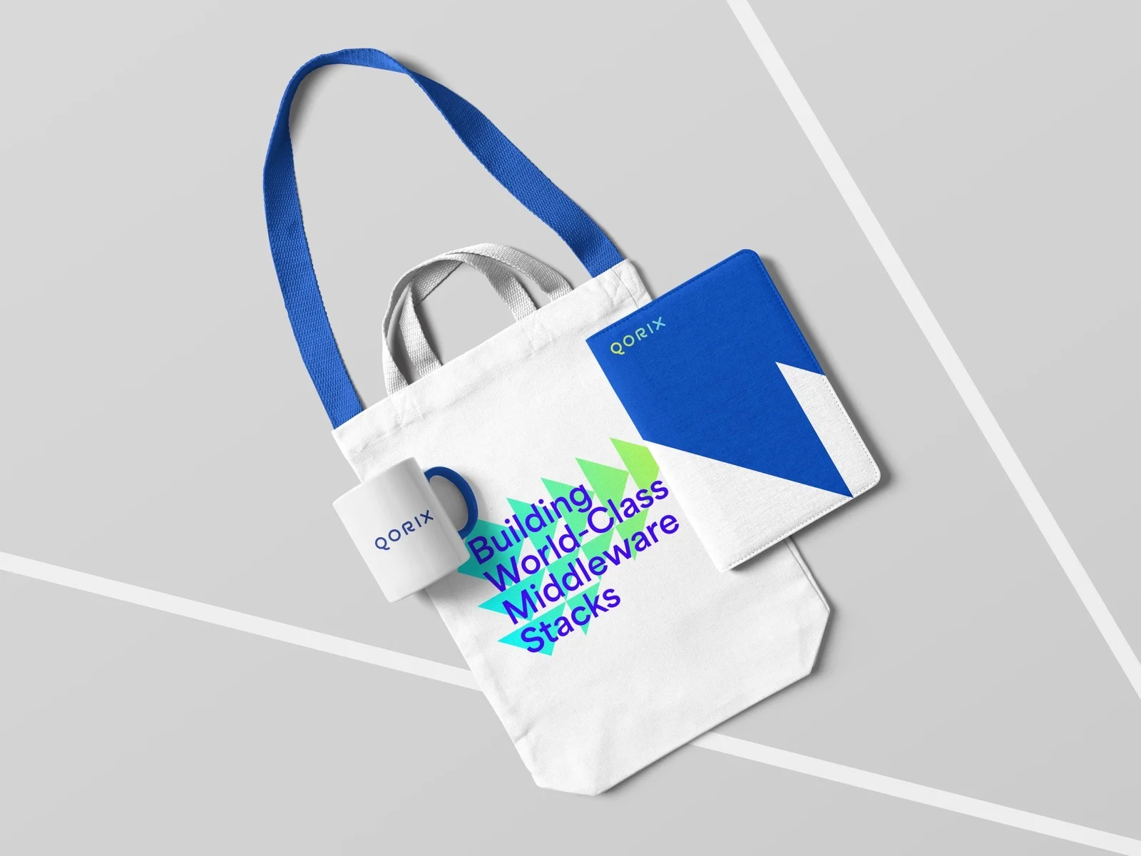 Stofftasche und Notizbuch mit Bildmarke — Qorix, laufende Designbetreuung